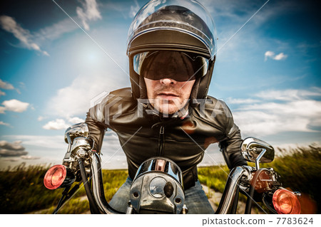 Biker racing on the road Biker racing on the road 7783624