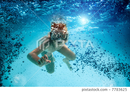 Teenager in the mask and snorkel swim underwater. Teenager in the mask and snorkel swim underwater. 7783625