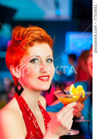 People in club or bar drinking cocktails 7783681