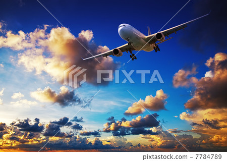 Jet maneuvering in a sunset sky 7784789
