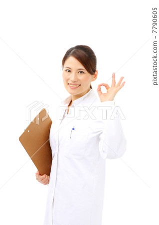 Female doctor issuing an okay sign 7790605