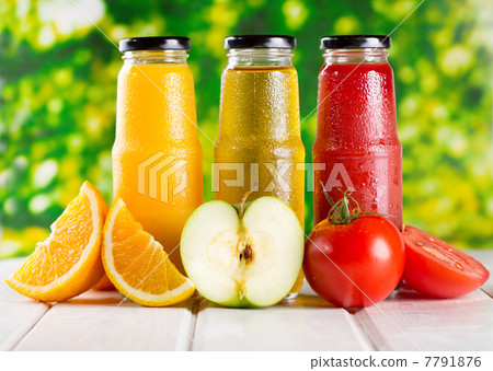 different bottles of juice with fruits different bottles of juice with fruits 7791876