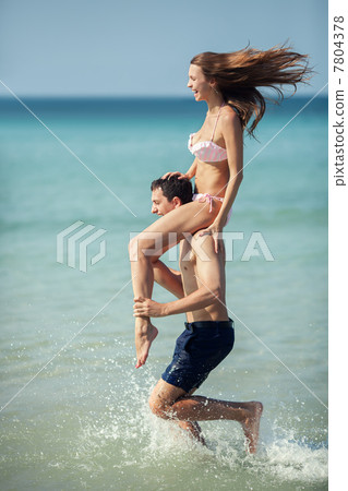 Couple running on a tropical beach. Vacation Couple running on a tropical beach. Vacation 7804378