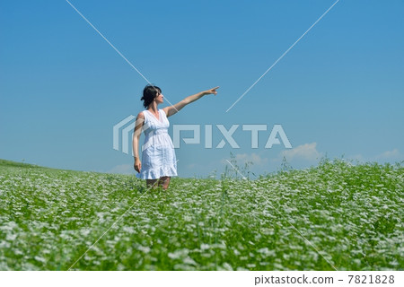Young happy woman in green field Young happy woman in green field 7821828