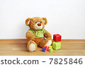 Toys - Teddy bear with cubes on laminate floor 7825846