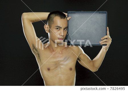 Young woman holding a notebook computer 7826495