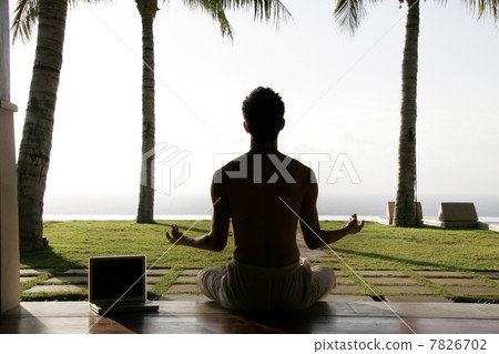 Rear view of man sitting on the floor Rear view of man sitting on the floor 7826702
