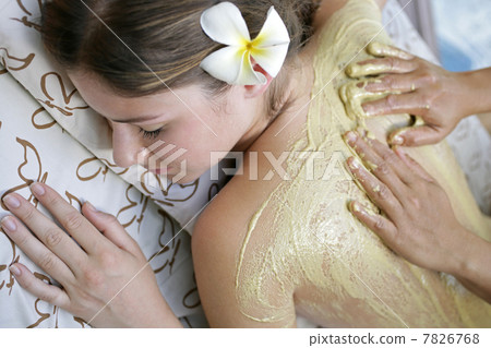 Woman receiving back massage 7826768