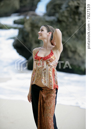 Young woman posing on the beach Young woman posing on the beach 7827139