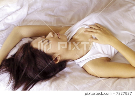 High angle view of woman lying in bed High angle view of woman lying in bed 7827927
