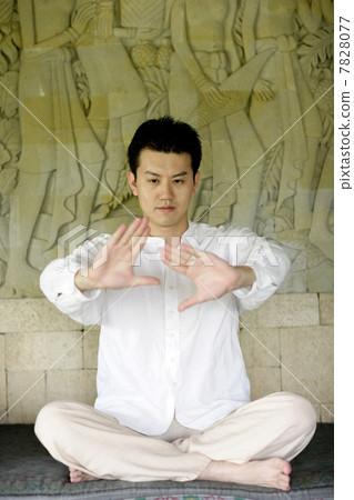 Young man practising yoga 7828077