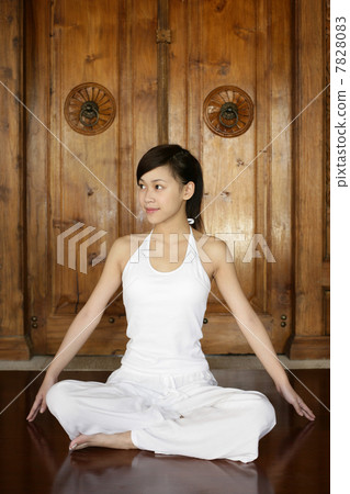 Young woman practising yoga 7828083