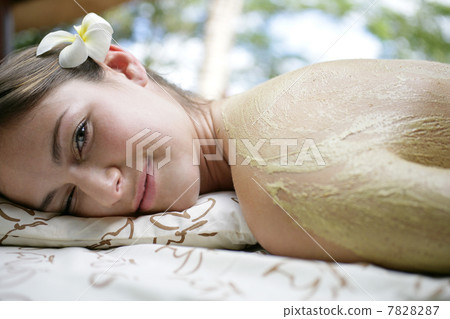 Woman receiving body care 7828287