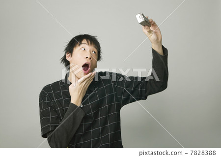 Young man taking photo of himself 7828388