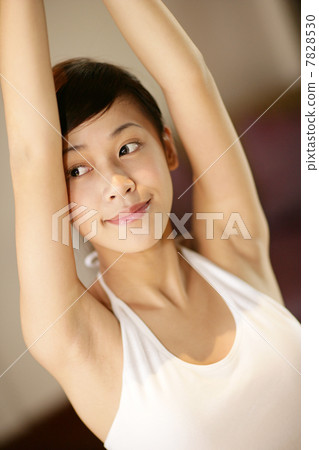 Young woman practising yoga 7828530