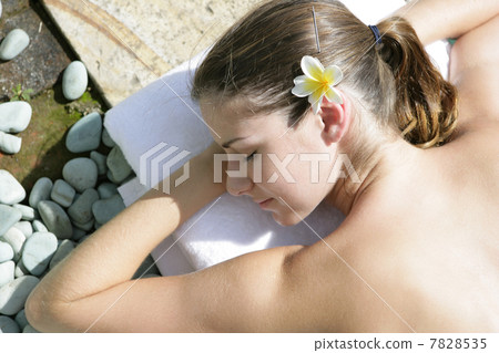 Woman enjoying sunbathing 7828535