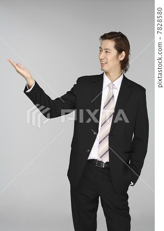 Side view of young man wearing suit 7828580