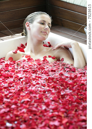 Woman having flower bath Woman having flower bath 7828615