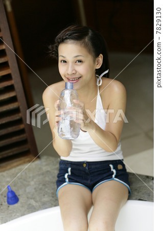 Young woman drinking water 7829130