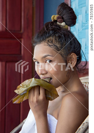 Woman eat sticky rice 7835985