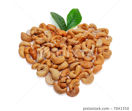 Cashew nuts in the form of heart with leaves isolated on white b Cashew nuts in the form of heart with leaves isolated on white b 7841358