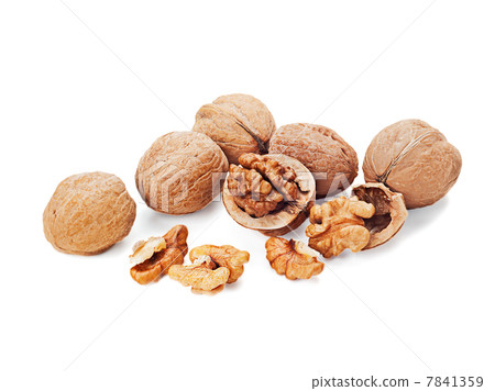 walnuts and a cracked walnut isolated on the white background walnuts and a cracked walnut isolated on the white background 7841359