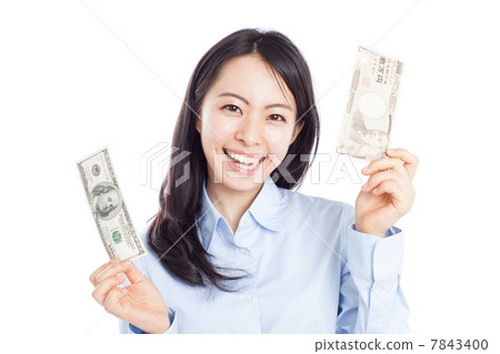 A woman holding a banknote 7843400