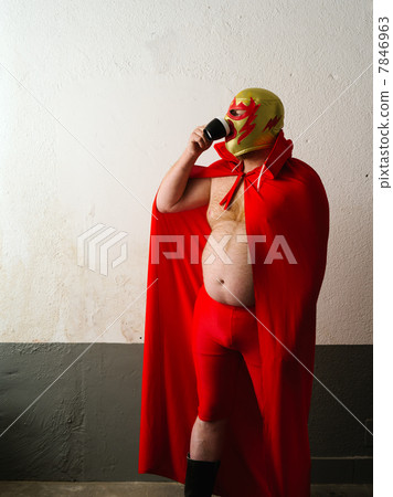 Mexican wrestler drinking coffee 7846963