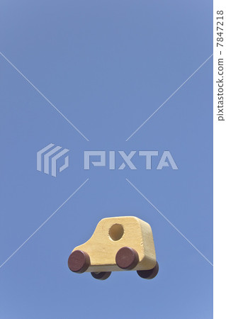 A wooden toy car floating in the air like a flying sky A wooden toy car floating in the air like a flying sky 7847218