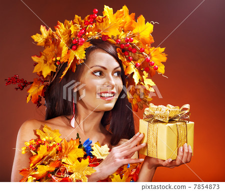 Girl with a wreath of autumn leaves on the head. Girl with a wreath of autumn leaves on the head. 7854873