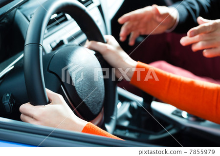 Young woman at driving lesson 7855979