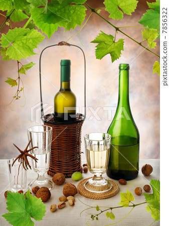 Still life with wine, grapevine and nuts 7856322