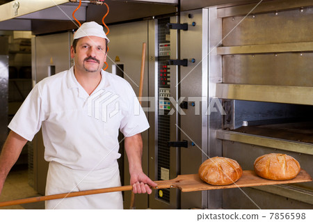 Male baker baking bread Male baker baking bread 7856598