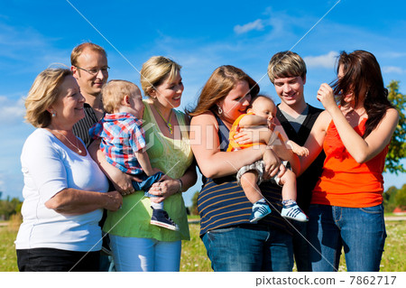 Family and multi-generation - fun on meadow in summer 7862717