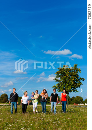 Family and multi-generation - fun on meadow in summer 7862719