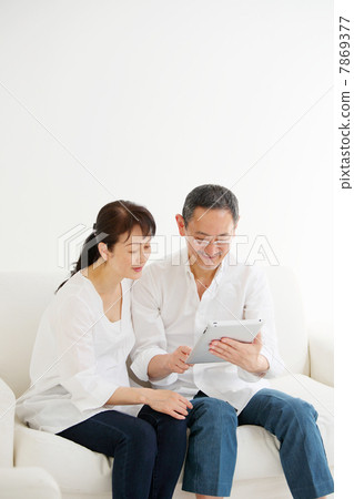 Senior couple using iPad Senior couple using iPad 7869377