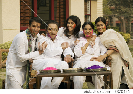 Family celebrating Holi  7870435