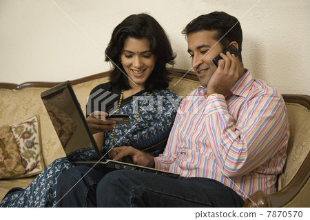 Couple net banking on a laptop Couple net banking on a laptop 7870570