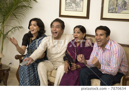 Family watching T.V.  7870634