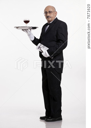 A butler serving a drink A butler serving a drink 7871620