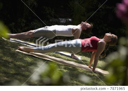 Man and woman doing yoga  7871965