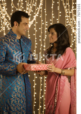 Couple exchanging presents Couple exchanging presents 7873101