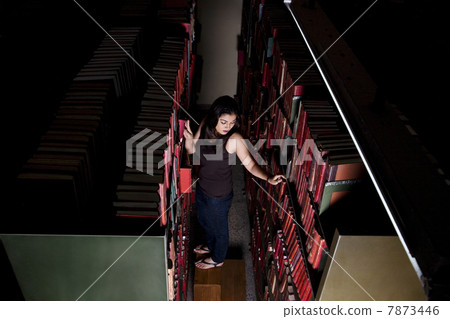College student in the library College student in the library 7873446