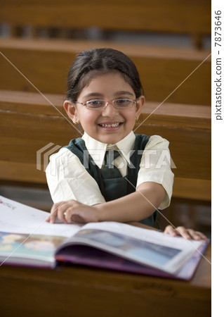 Student reading a book Student reading a book 7873646