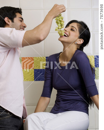 Feeding grapes  7873698