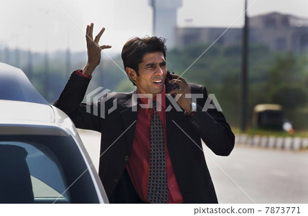 Executive talking on the mobile phone Executive talking on the mobile phone 7873771