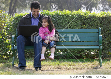 Father and daughter with a laptop Father and daughter with a laptop 7873878