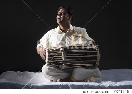 Man playing the tabla Man playing the tabla 7873956