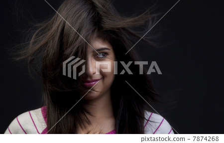 Hair covering half of a woman's face Hair covering half of a woman's face 7874268