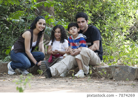 Portrait of a family in a park  7874269